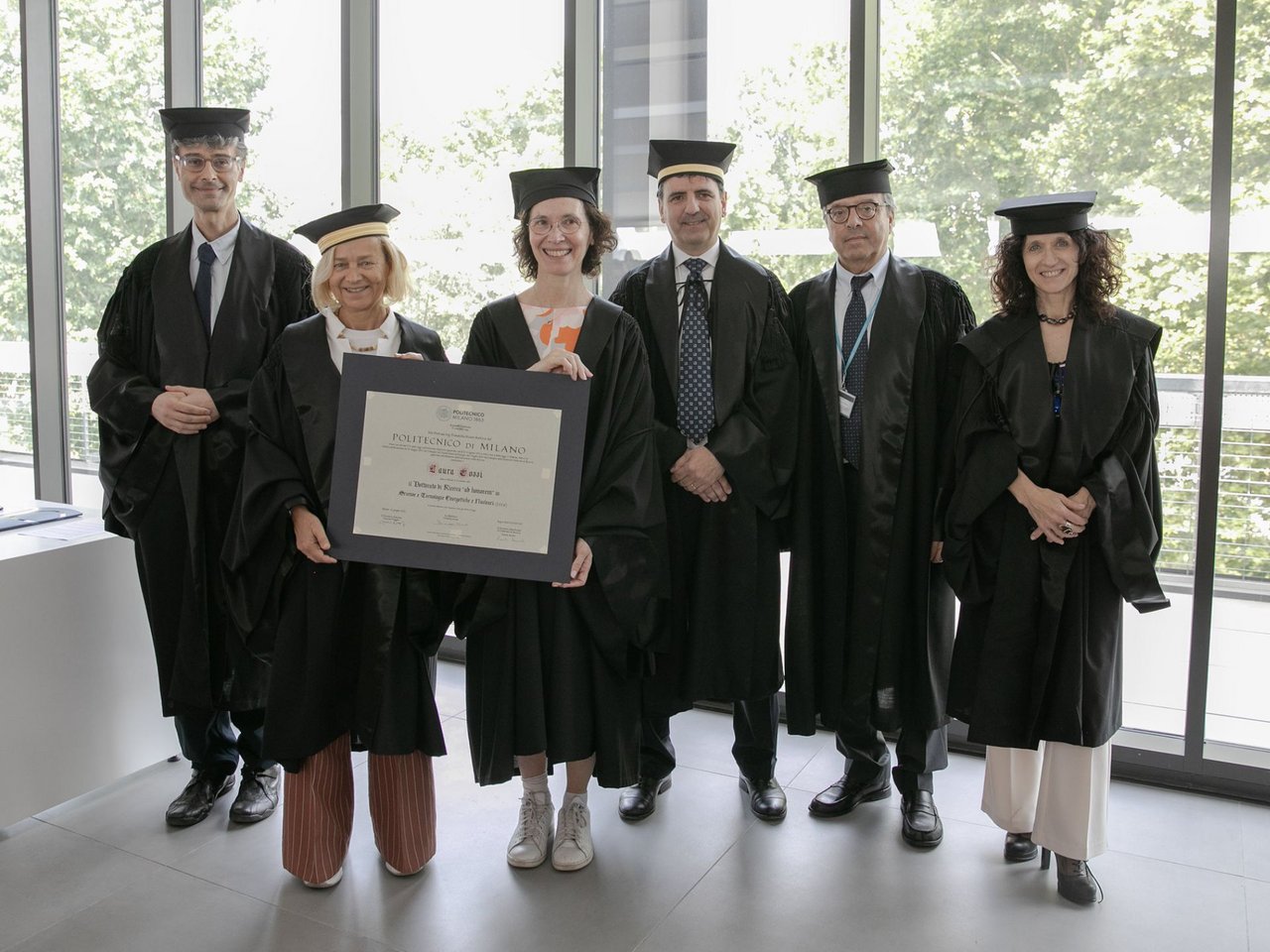 Laura Cozzi with the doctoral commission class=